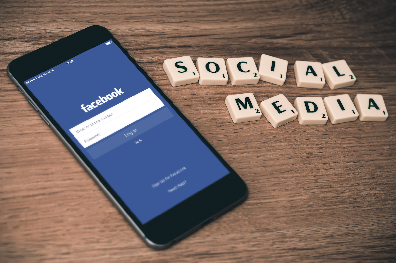 Phone showing a social media app next to the word social media