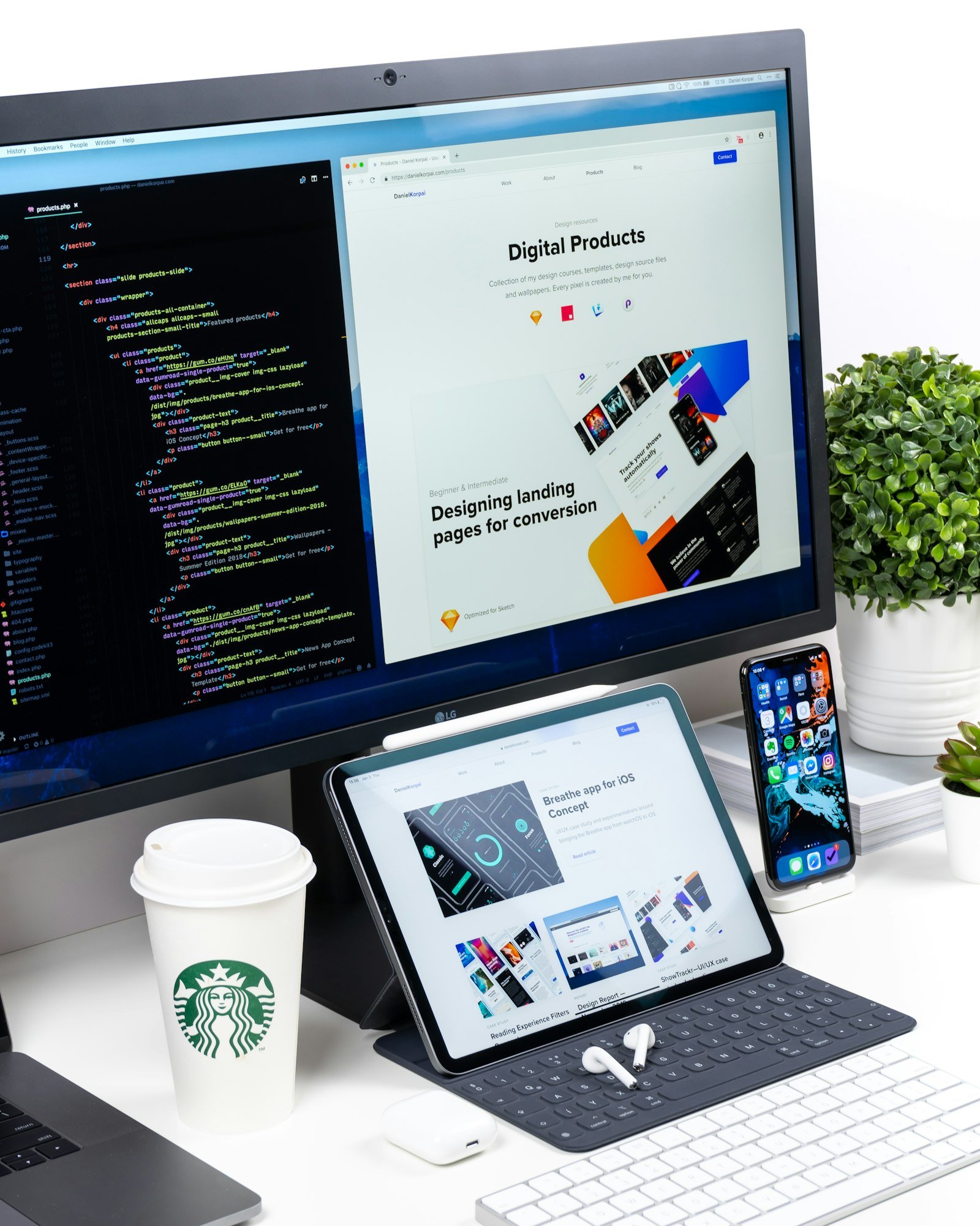 Monitor showing code beside a landing page design